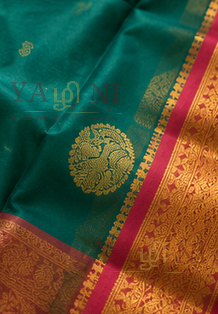 Peacock Green Soft Silk Saree with Pink Border & Traditional Gold Zari Weaving